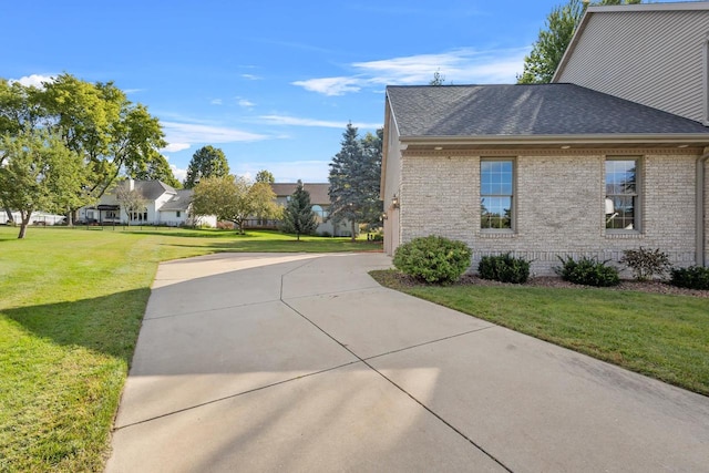 view of property exterior with a yard