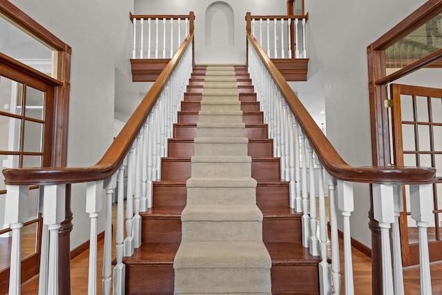 stairway featuring wood-type flooring