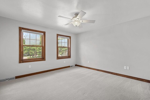 kitchen featuring dark carpet, kitchen peninsula, and a drop ceiling