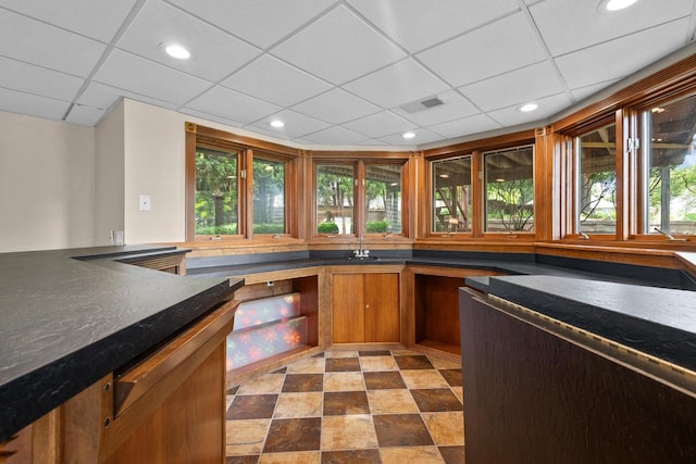 kitchen featuring a paneled ceiling