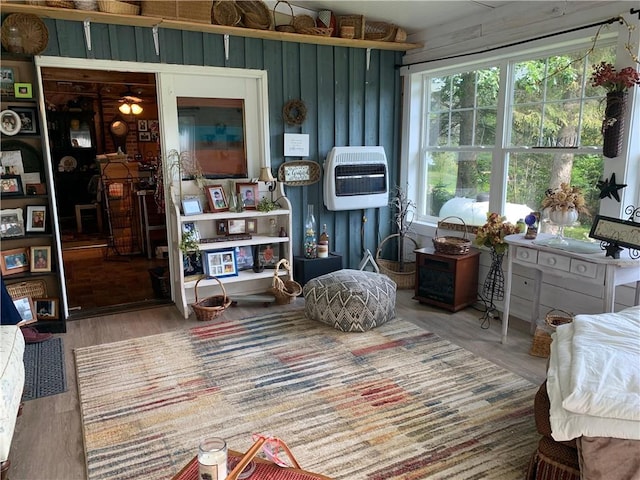 interior space with hardwood / wood-style floors and heating unit