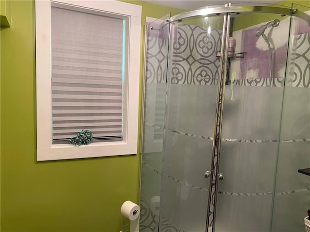 bathroom featuring an enclosed shower