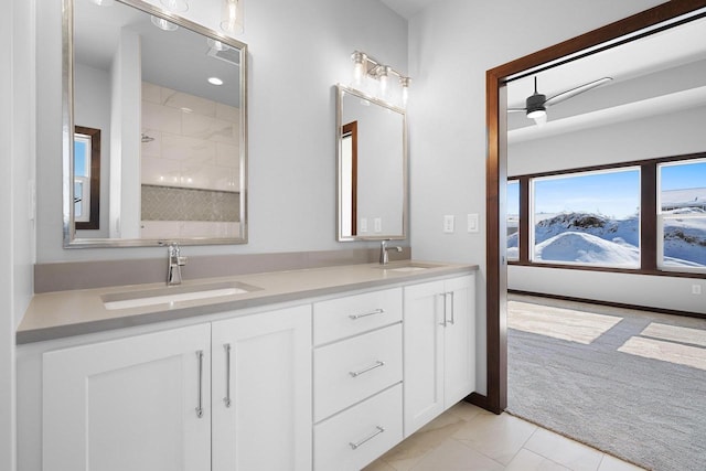 bathroom featuring vanity, tile patterned floors, and walk in shower