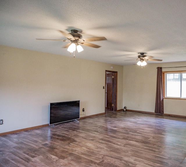 unfurnished living room featuring a textured ceiling, dark wood-type flooring, and ceiling fan