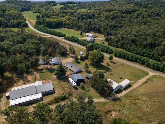 birds eye view of property with a rural view