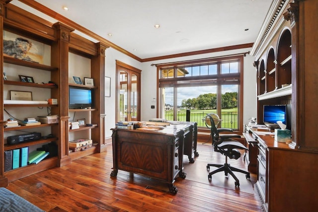 office area with hardwood / wood-style floors and crown molding