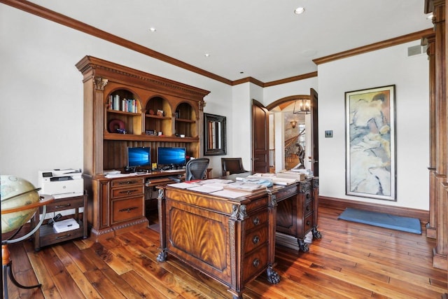 office with wood-type flooring and ornamental molding