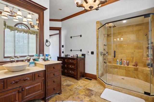 bathroom featuring walk in shower, ornamental molding, and vanity