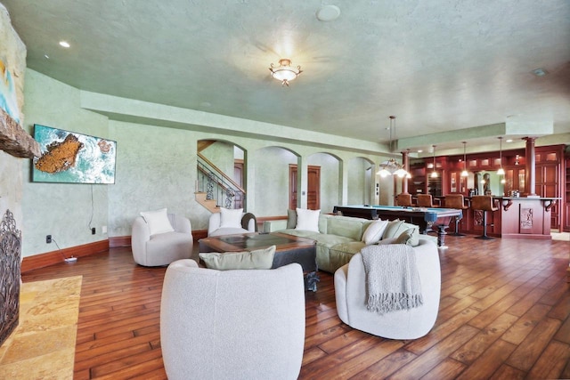 living room featuring billiards and dark wood-type flooring