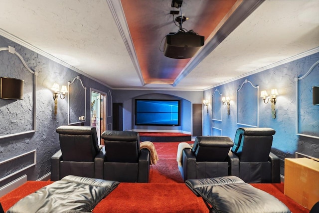 home theater with crown molding, carpet flooring, and a raised ceiling