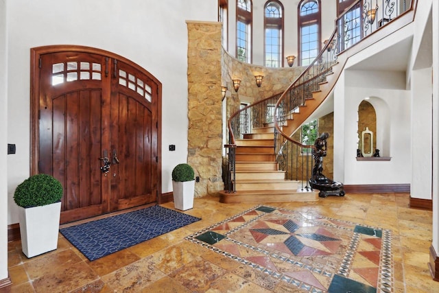 foyer entrance featuring a high ceiling