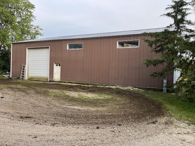 view of outbuilding featuring a garage