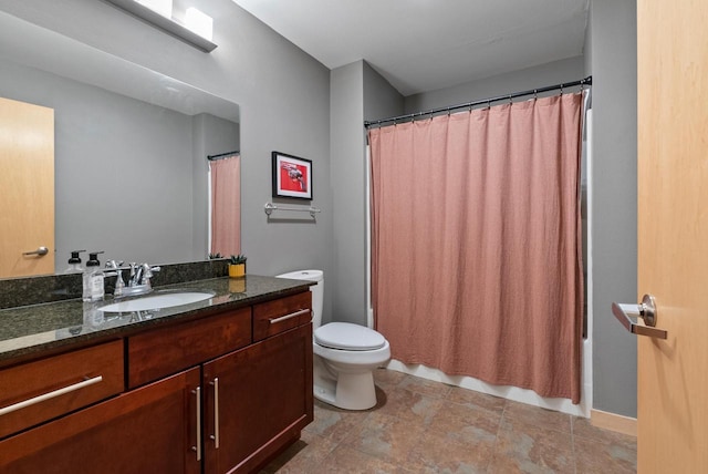 bathroom featuring vanity, toilet, and shower / tub combo with curtain