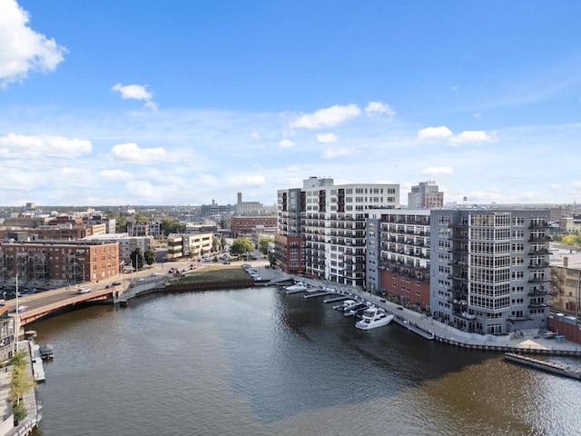 bird's eye view featuring a water view and a city view