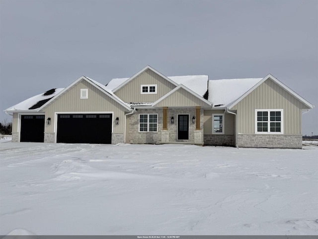 5090 N Cobble Creek Dr, Grand Chute, WI 54913 - view of front of home with stone siding, a garage, and board and batten siding