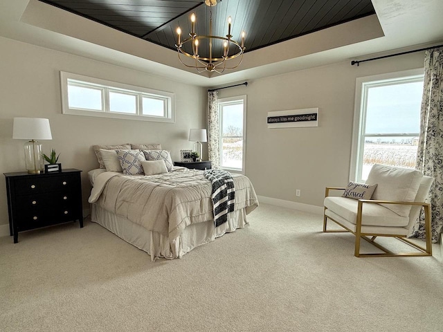 5090 N Cobble Creek Dr, Grand Chute, WI 54913 - bedroom featuring a chandelier, light colored carpet, baseboards, a raised ceiling, and wooden ceiling