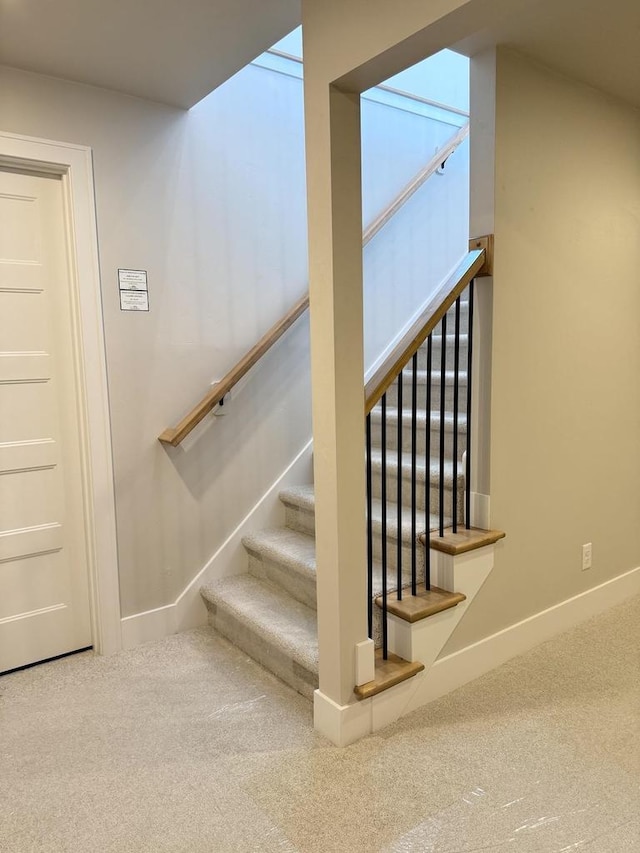 stairway with carpet and baseboards