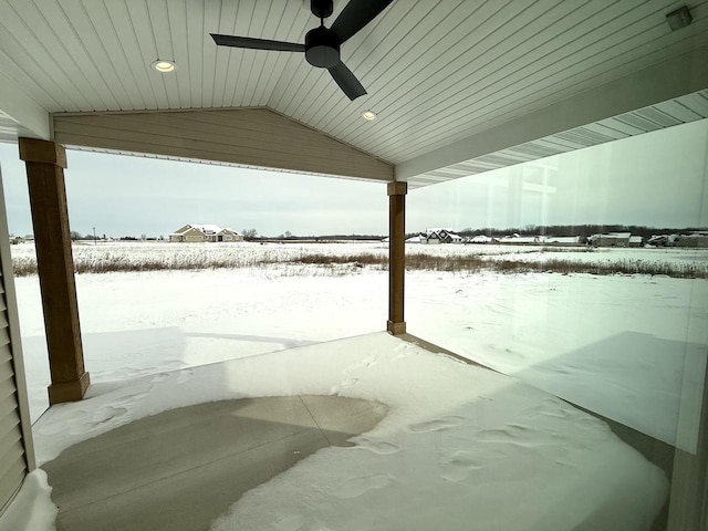 snow covered patio featuring ceiling fan