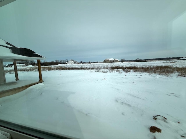 view of yard layered in snow