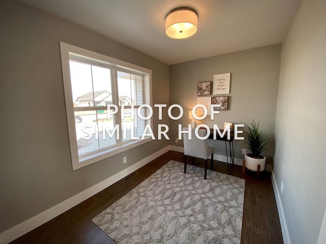 home office with dark hardwood / wood-style flooring