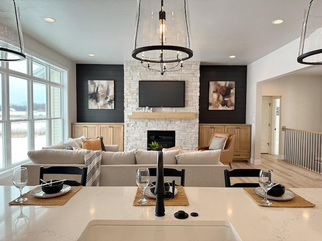 5090 N Cobble Creek Dr, Grand Chute, WI 54913 - living room with recessed lighting, a stone fireplace, and wood finished floors
