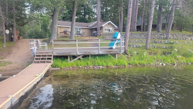 dock area featuring a deck with water view