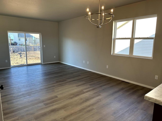 interior space with dark hardwood / wood-style flooring and an inviting chandelier