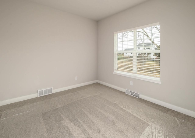 empty room featuring carpet flooring