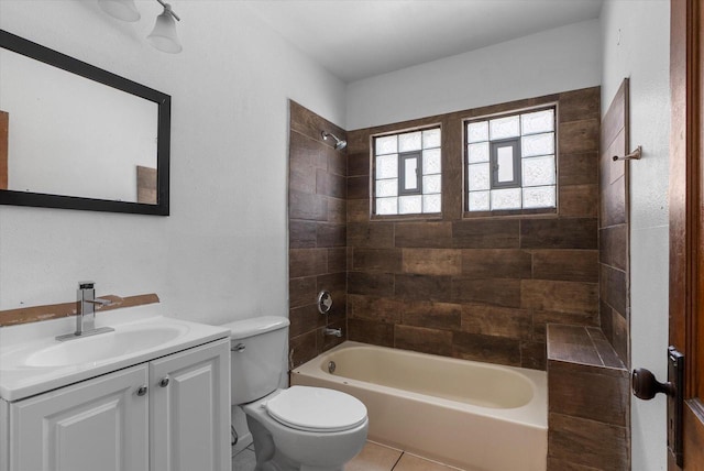 full bath with tile patterned flooring, toilet, vanity, and shower / tub combination