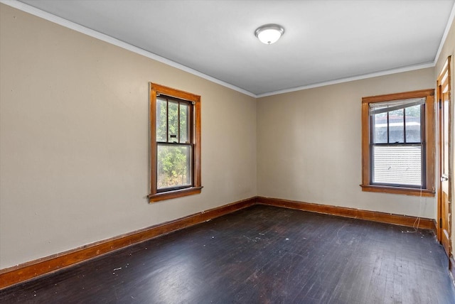 unfurnished room featuring a wealth of natural light, baseboards, dark wood finished floors, and ornamental molding