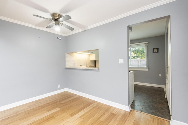 unfurnished room featuring ornamental molding, hardwood / wood-style floors, and ceiling fan