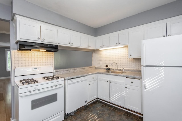 kitchen with sink, white appliances, white cabinetry, and decorative backsplash