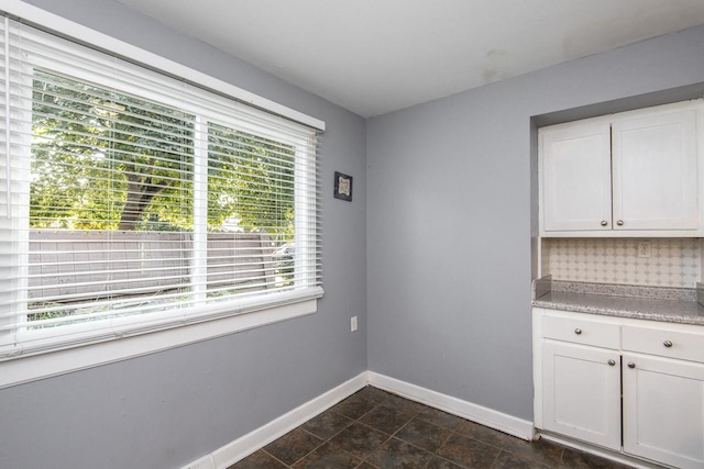 unfurnished dining area with plenty of natural light