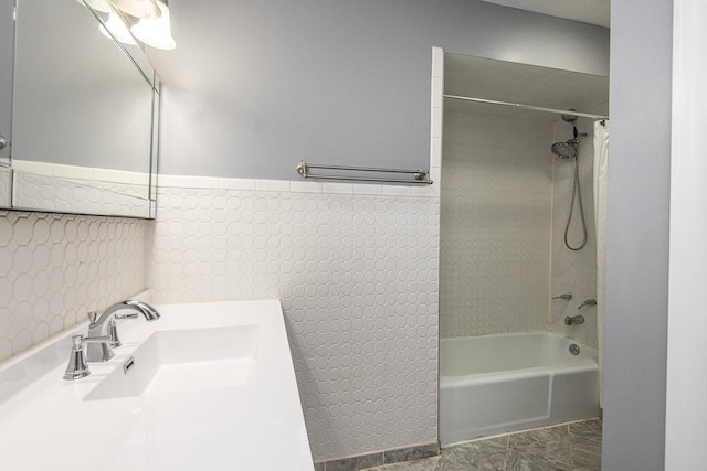 bathroom featuring vanity and shower / bathtub combination with curtain