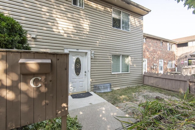 view of exterior entry featuring a patio