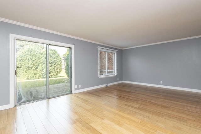 unfurnished room featuring ornamental molding and light hardwood / wood-style floors