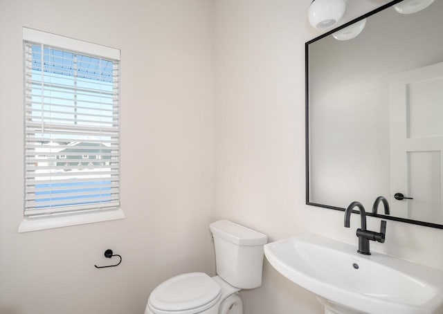 bathroom with toilet and sink