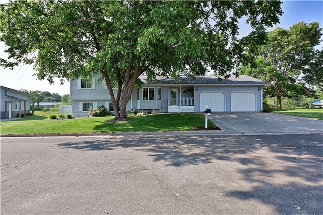 view of front of house with a garage and a front yard