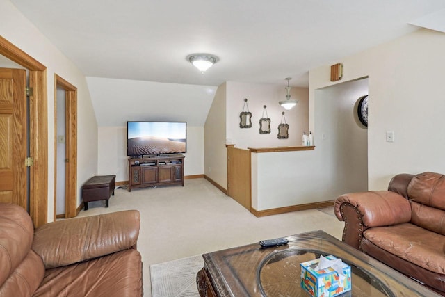 living room with light colored carpet and vaulted ceiling