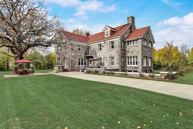 exterior space with a patio and a front yard