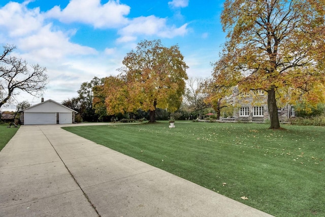 view of yard with an outdoor structure and a garage