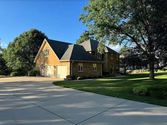 view of front facade with a garage and a front lawn