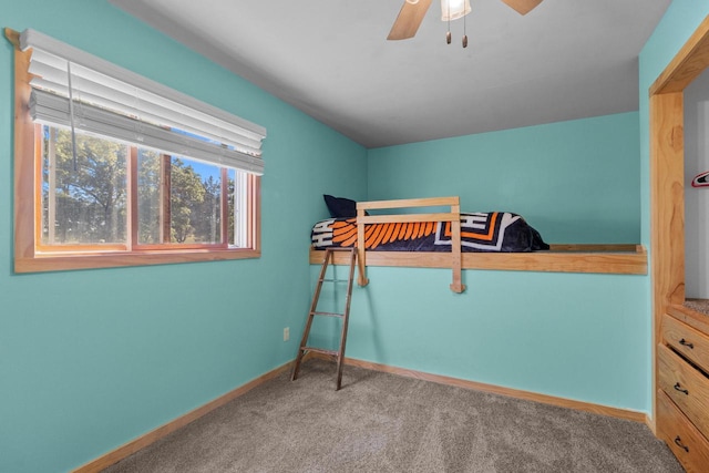 bedroom with ceiling fan and carpet flooring