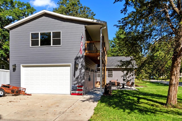 view of property featuring a balcony, a garage, and a front lawn