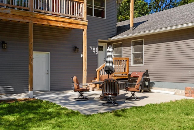 view of patio / terrace featuring a grill and an outdoor fire pit