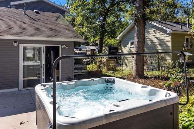 view of pool featuring a hot tub