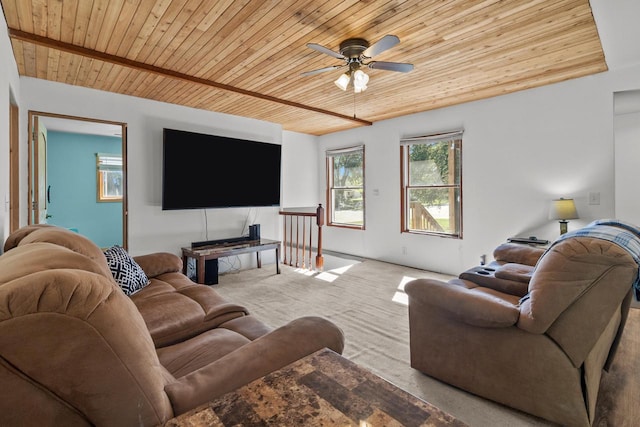 living room featuring ceiling fan, light colored carpet, and wood ceiling