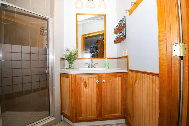 kitchen with a textured ceiling, light tile patterned flooring, stainless steel fridge with ice dispenser, and decorative light fixtures