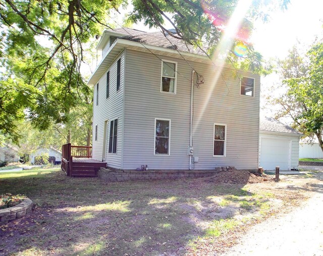 view of front facade with a garage and a front lawn