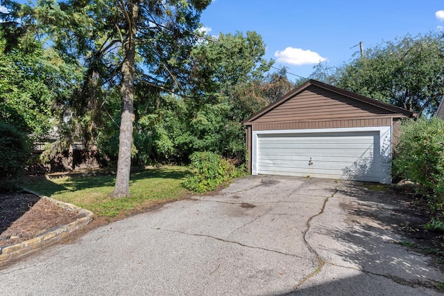 garage featuring a yard